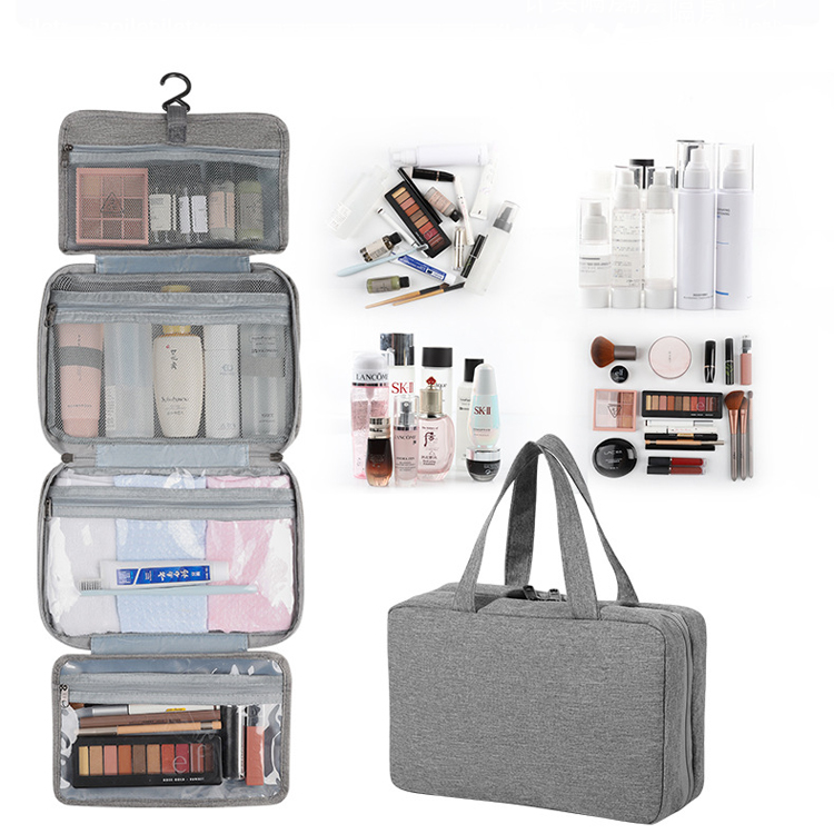 Grey folding travel toiletry organizer shown open with hanging hook and multiple compartments